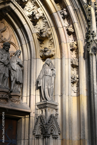 Statue of Saint Virgin Mary at the entrance of a european cathedral
