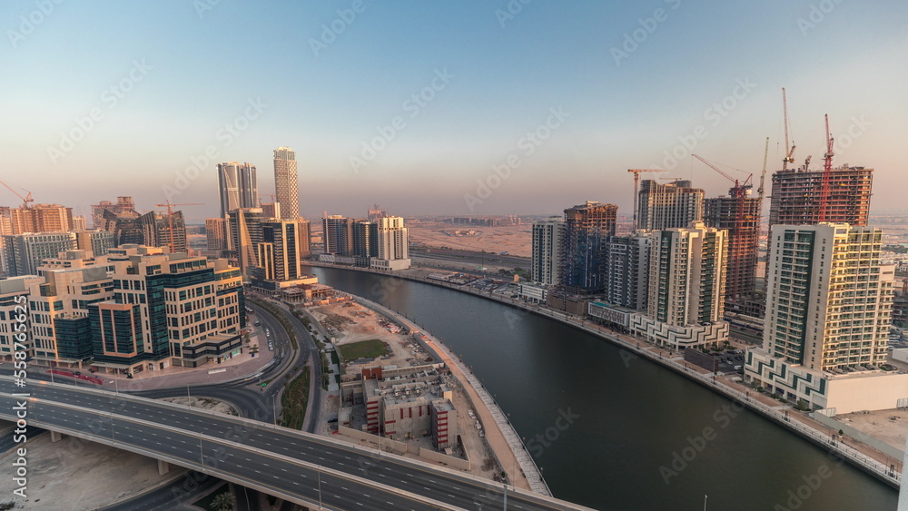 Skyscrapers at the Business Bay aerial evening timelapse in Dubai, United Arab Emirates