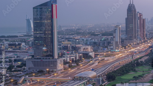 Aerial view of Sheikh Zayed Road in Dubai Internet City area night to day timelapse