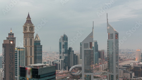 Skyscrapers on Sheikh Zayed Road and DIFC day to night timelapse in Dubai, UAE.