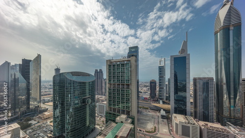 Dubai international financial center skyscrapers with cloudy blue sky aerial all day timelapse. © neiezhmakov
