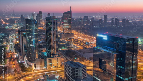 Wallpaper Mural Aerial view of media city and al barsha heights district area night to day timelapse from Dubai marina. Torontodigital.ca