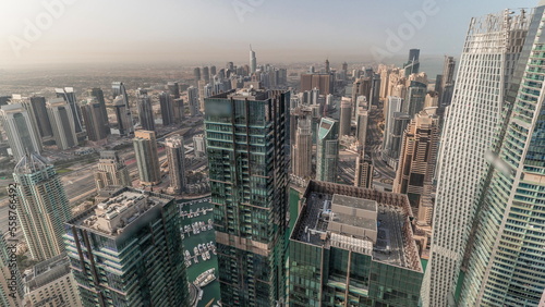 Panorama showing Dubai Marina and JLT with JBR district. Ttraffic on highway between skyscrapers aerial timelapse. © neiezhmakov