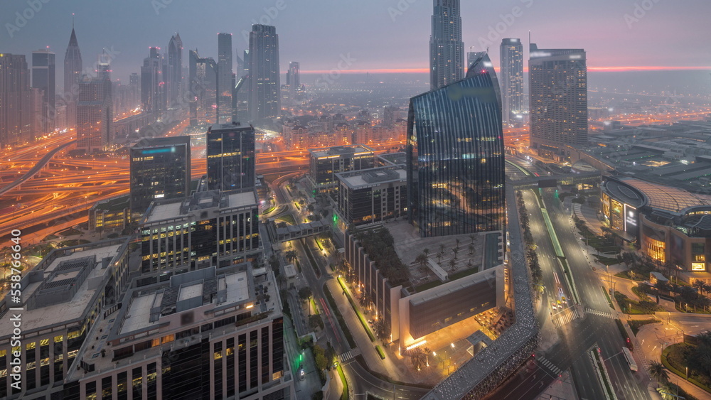 Fototapeta premium Futuristic Dubai Downtown and finansial district skyline aerial night to day timelapse.