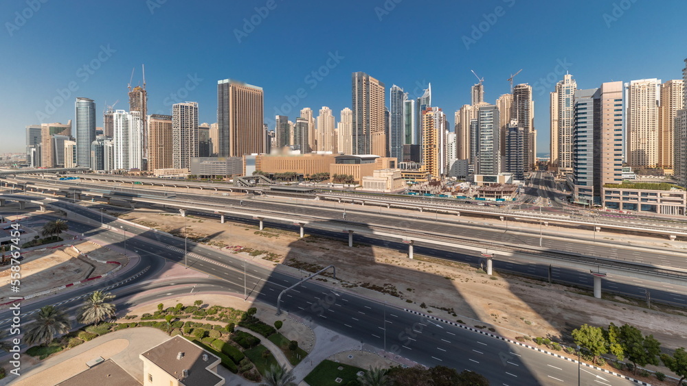 Panorama showing Dubai Marina skyscrapers and Sheikh Zayed road with metro railway, United Arab Emirates