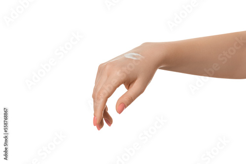 Beautiful young woman hands with cream. Woman applies cream on her hands, isolated.