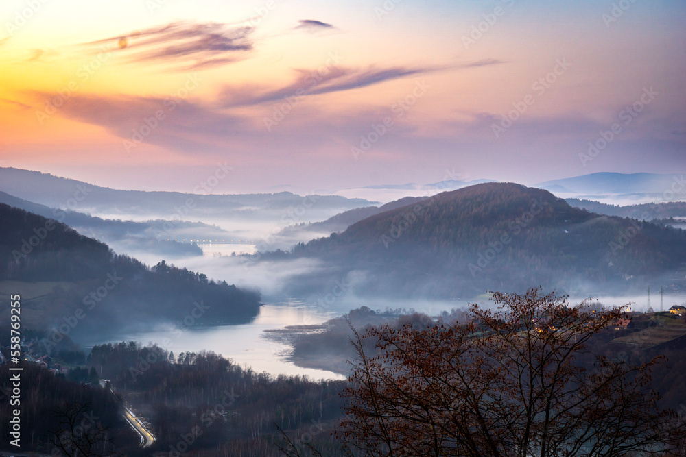 Sunset over the Biieszczady mountains during misty evening - view from Jawor hill