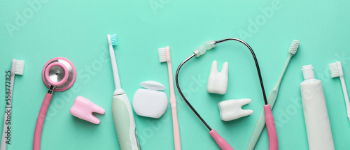 Set for oral hygiene and stethoscope on turquoise background
