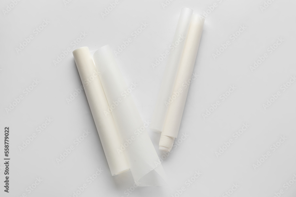 Rolls of baking paper on white background Rolls of baking paper on white background