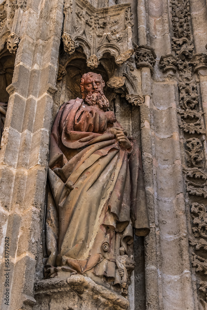 Roman Catholic Cathedral of Saint Mary of the See (Catedral de Santa Maria de la Sede, 1528). West facade. Door of Baptism decorated with a scene depicting baptism of Jesus. Seville, Andalusia, Spain. Roman Catholic Cathedral of Saint Mary of the See (Catedral de Santa Maria de la Sede, 1528). West facade. Door of Baptism decorated with a scene depicting baptism of Jesus. Seville, Andalusia, Spain.