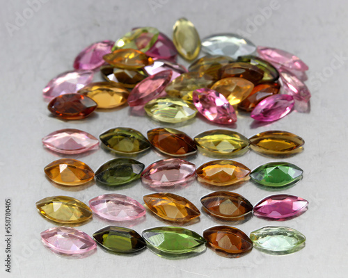 Natural beautiful gemstones multicolored tourmaline on a gray background