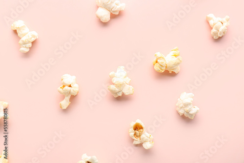 Tasty popcorn on pink background