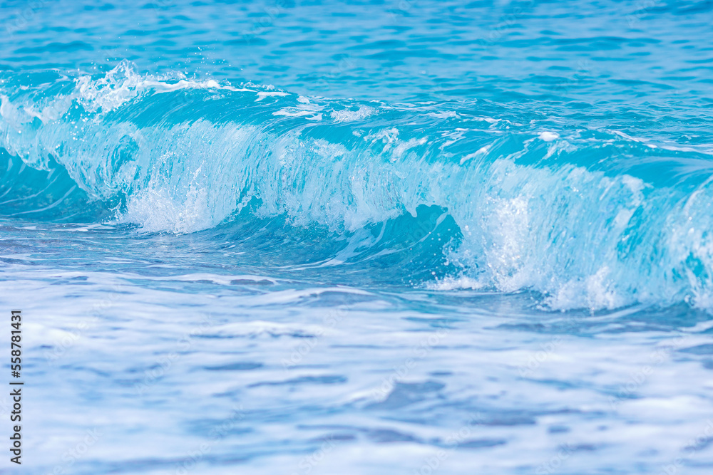 Nature background, start storm on blue sea wave on beach with splash Nature background, start storm on blue sea wave on beach with splash
