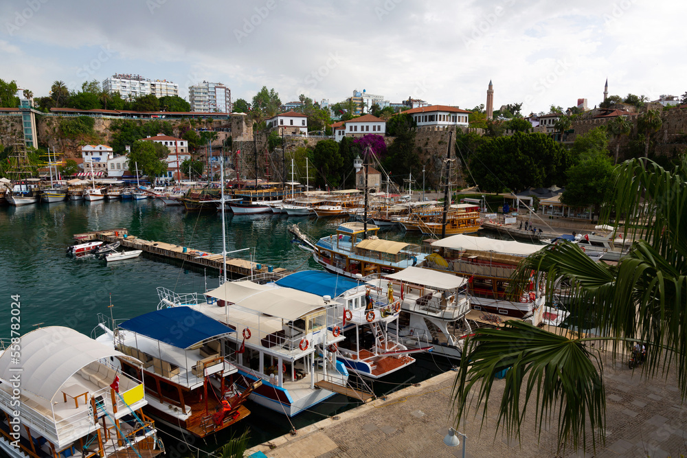 Old town port of Antalya with moored boats. Mediterranean coast in Antalya Province, Turkey.
