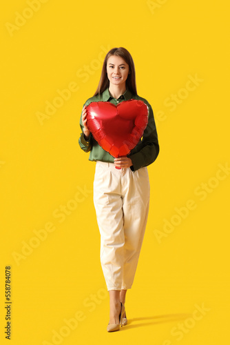 Young woman with balloon fo...