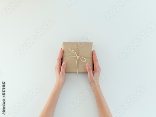 Woman's hands Holding holiday gift photo
