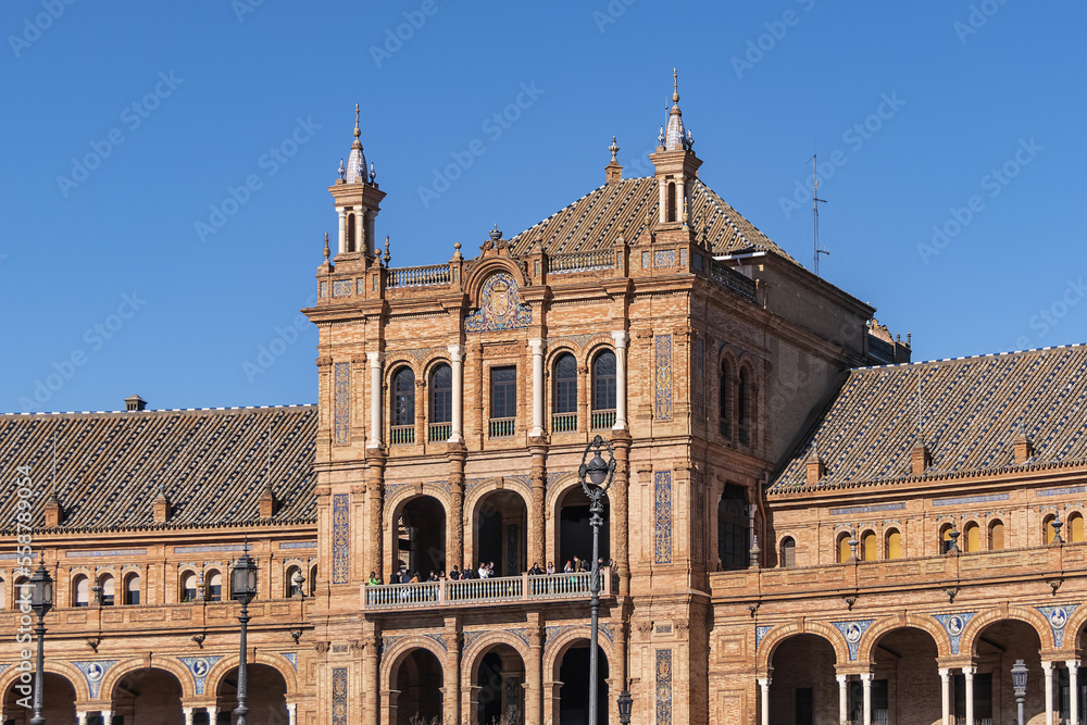 The picturesque renaissance and Moorish building styles in the Spain square (Plaza de Espana). Seville, Andalusia, Spain.