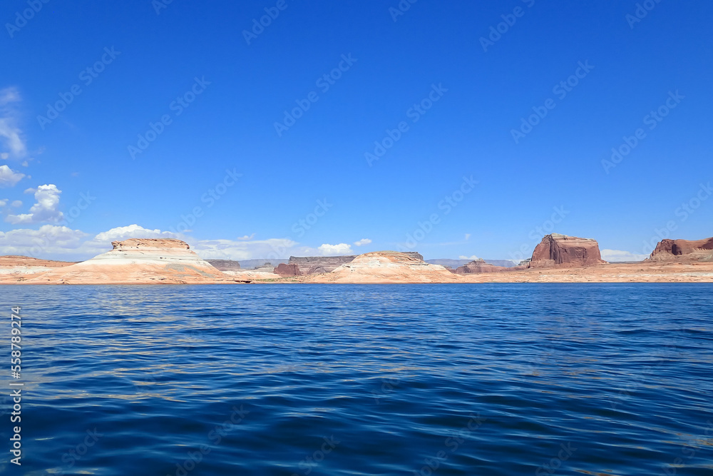 Naklejka premium Colorful sandstone rock formations along the Colorado River at Glen Canyon National Recreation Area