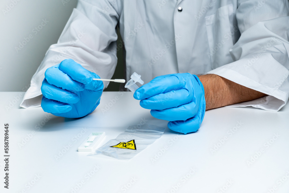 Nurse performing Rapid antigen Covid 19. For in vitro diagnostic use