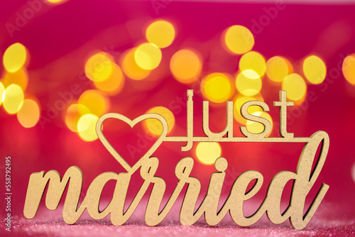 just married inscription on a bright pink fuchsia background .wedding symbol.Holiday of love and family