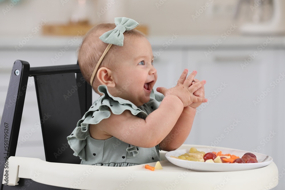 Cute little girl eating healthy food at home Cute little girl eating healthy food at home