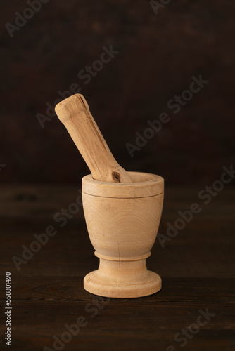 Isolate wooden mortar, closeup. Utensil tool for homemade grind. 