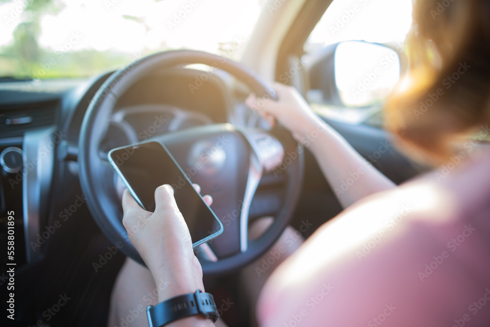 woman using mobile phone while driving woman using mobile phone while driving