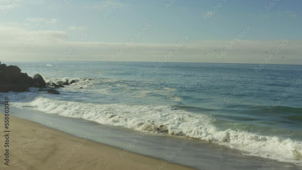 Tilt shot view of beautiful beach with cliff. Ocean videos. Tilt shot view of beautiful beach with cliff. Ocean videos.