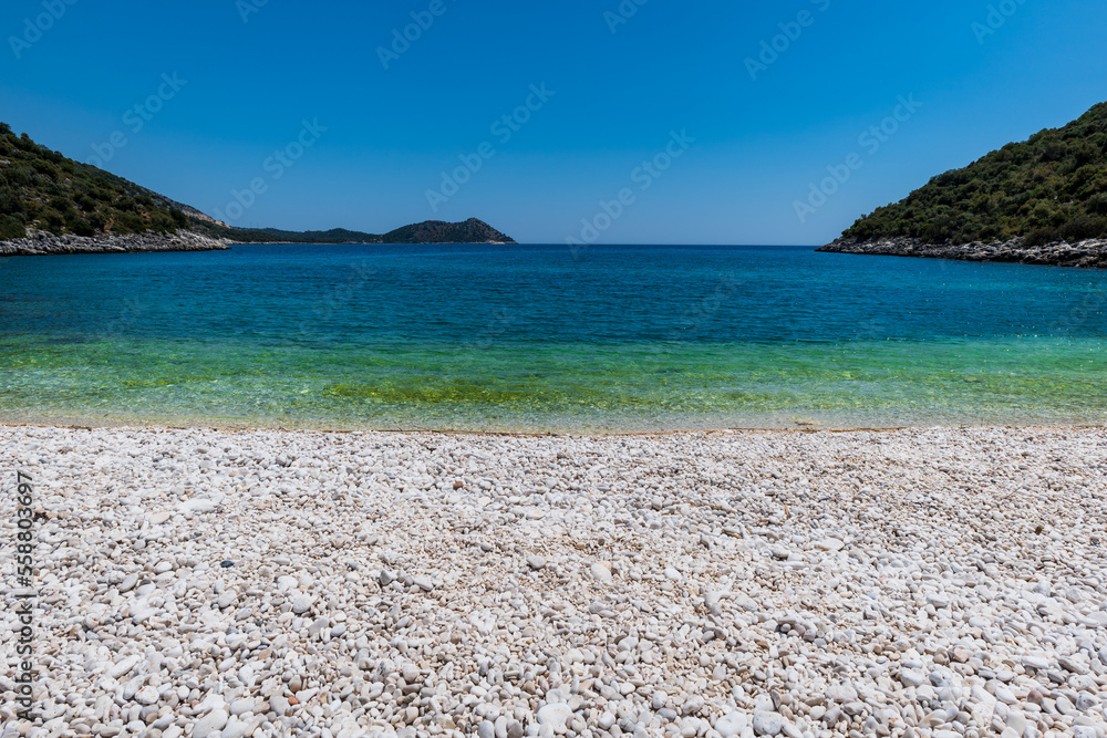 Beach landscape view by the Mediterranean sea in Antalya region, Turley. Antalya is a popular resort area in Turkey.	