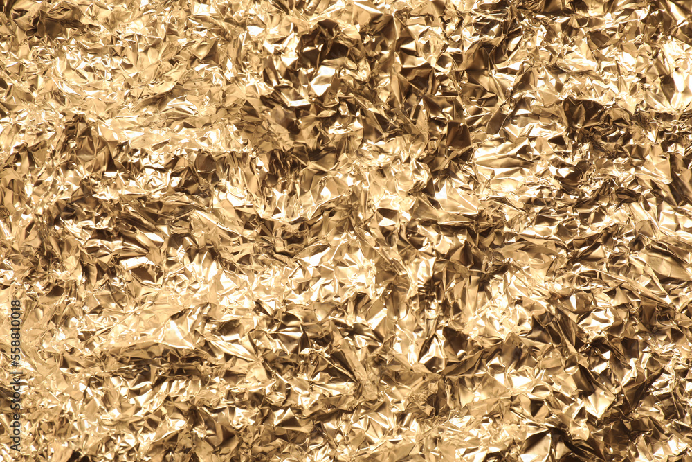 Crumpled gold foil as background, top view Crumpled gold foil as background, top view