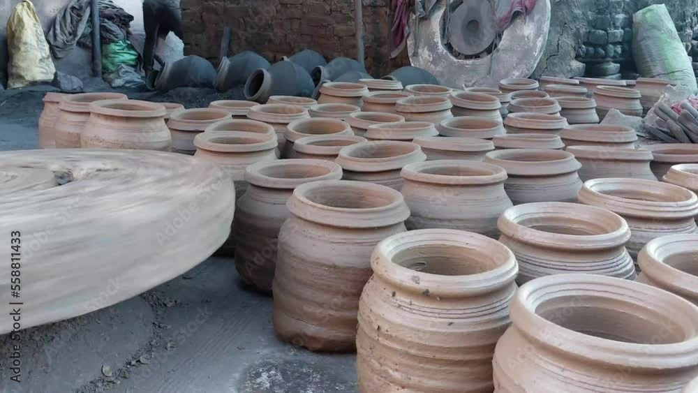 Mithi Making Potter making a clay pot or mitti ka mataka on the pottery wheel at the ...