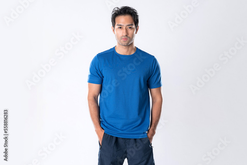Elegant young man in blue shirt standing on white background