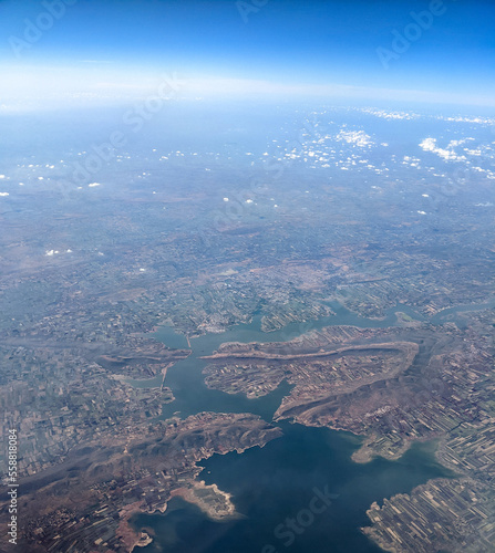 India, Bangalore to Mumbai, a view of a large body of water with a mountain in the background