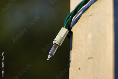 Holiday light on a metal flag pole 