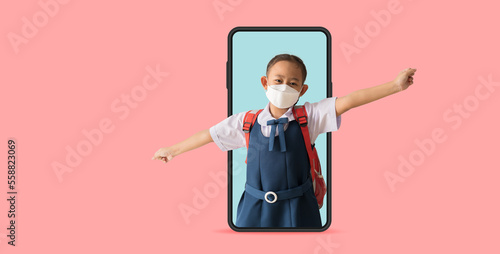 Asian school girl in uniform wear medical face mask with big smart phone frame