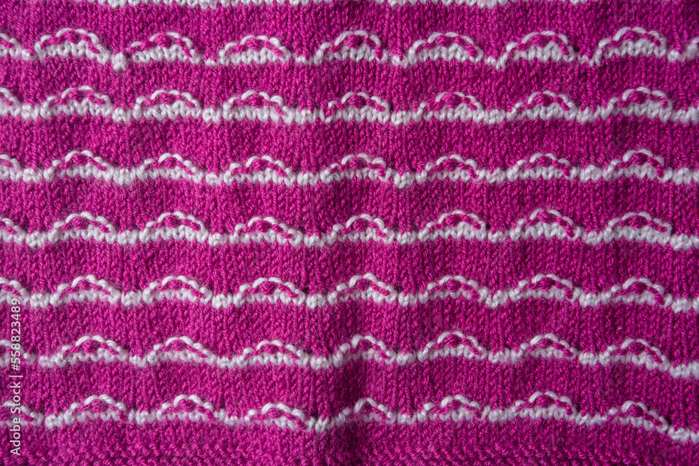 Knitted texture. Pattern fabric made of wool. Background, copy space. Handmade sweater texture, knitted wool pattern