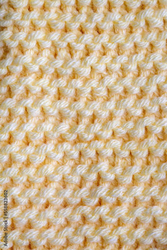 Knitted texture. Pattern fabric made of wool. Background, copy space. Handmade sweater texture, knitted wool pattern Knitted texture. Pattern fabric made of wool. Background, copy space. Handmade sweater texture, knitted wool pattern
