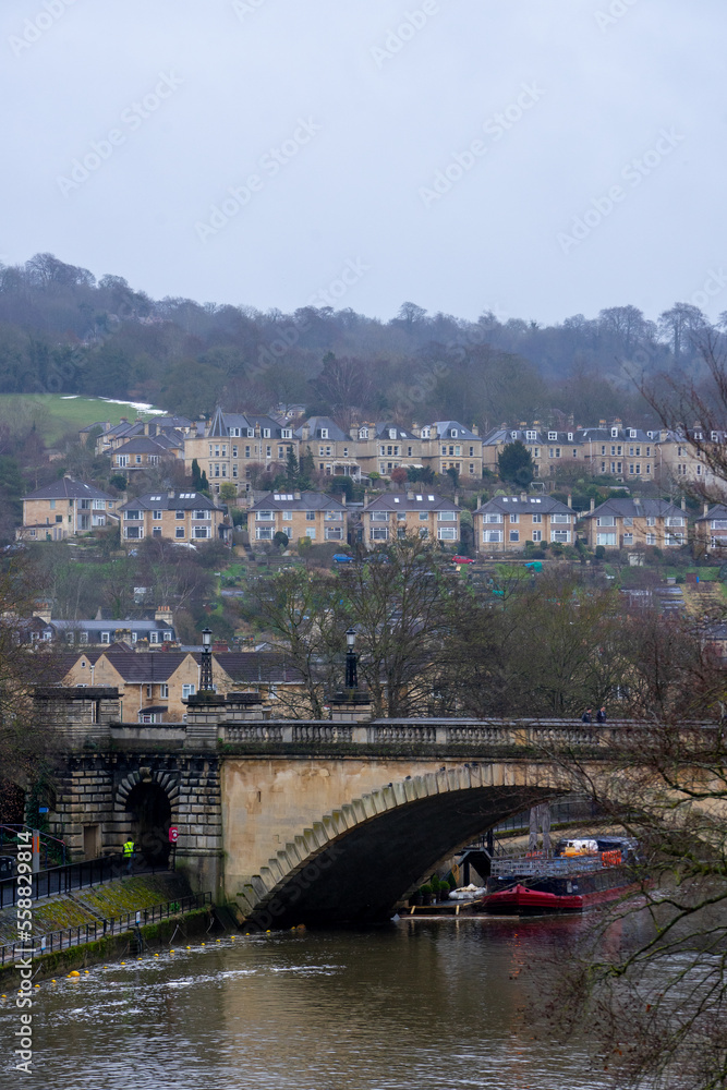 View of North Parade Bridge over River Avon near Pulteney Bridge in old town of Bath during winter evening at Bath , United Kingdom : 5 March 2018