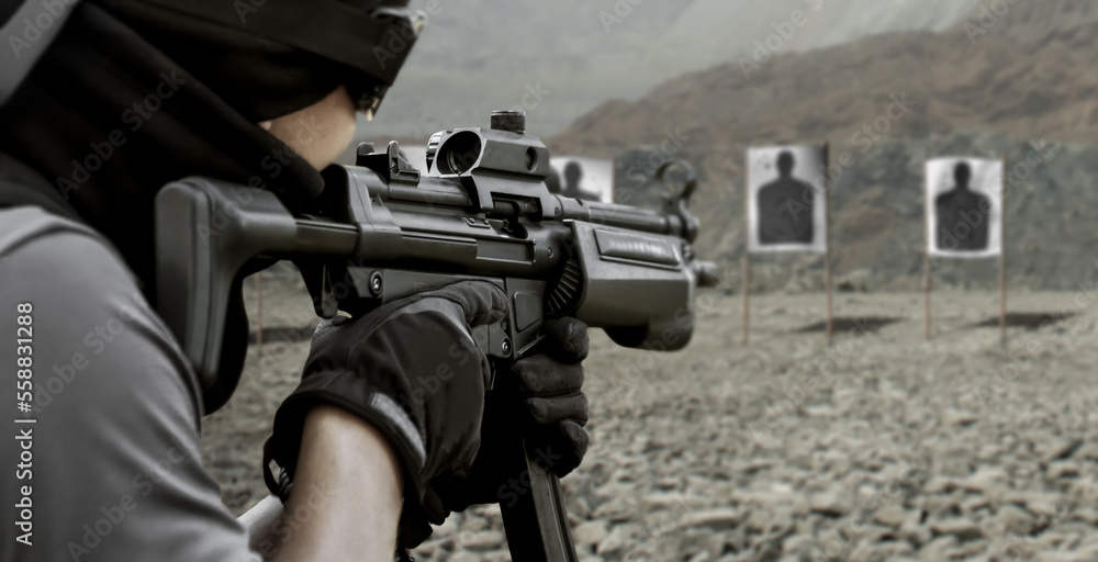 Military soldier shooter aiming mp5 sub machine assault rifle weapon at outdoor academy shooting range