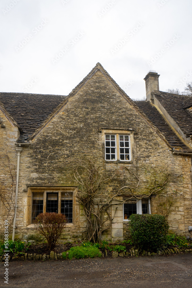 Castle Combe , Beautiful village in Cotwolds with old stone houses bridge and river during winter in Wiltshire , United Kingdom : 6 March 2018 Castle Combe , Beautiful village in Cotwolds with old stone houses bridge and river during winter in Wiltshire , United Kingdom : 6 March 2018