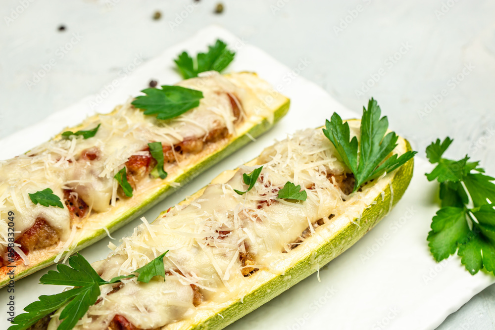 Zucchini stuffed with meat and cheese. Restaurant menu, dieting, cookbook recipe top view