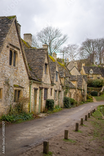 Arlington Row in Bibury , classic villages in Cotwolds wonderful stone buildings and river coln during winter cloudy day at Gloucestershire , United Kingdom : 6 March 2018