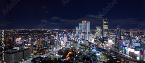 Ultra wide image of Nagoya station and its vicinity downtown area with high rise buildings at night. 