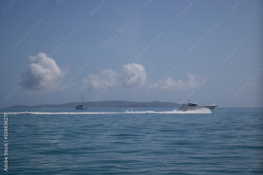 Two Boats Speeding Past