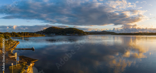 Early morning panorama over the bay with clouds © Merrillie