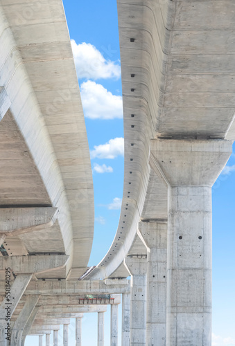 Canvas Print Elevated expressway foundation structure in under construction against blue sky