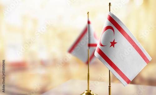 Small flags of the Northern Cyprus on an abstract blurry background