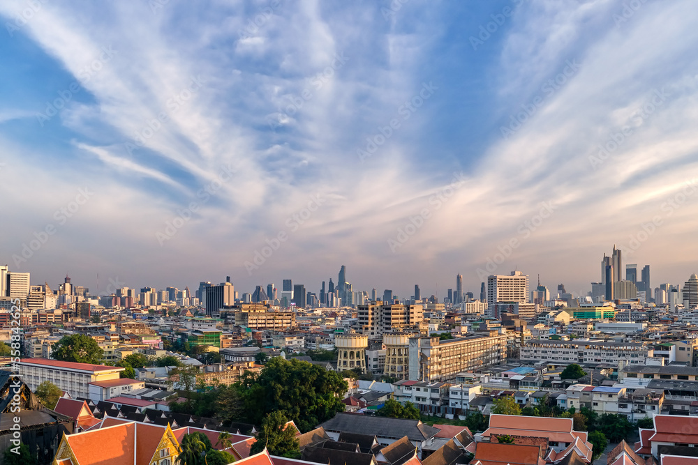 Cityscape of Bangkok city center in sunset, blue sky and clouds