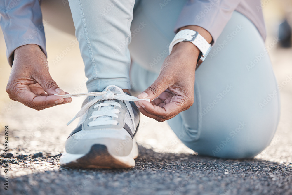 Woman, hands and shoelace for street runner, outdoor workout and fitness in summer sunshine in morning. Running adventure, shoes and tie lace for safety, speed and balance in road exercise for health