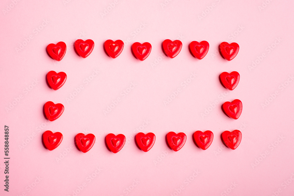 Rectangular frame made with hearts on pink background. Love concept. Rectangular frame made with hearts on pink background. Love concept.